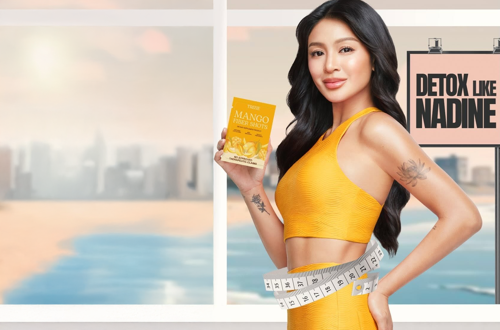 Nadine Lustre, the newest face of Trizie, holds a box of Trizie Mango Fiber Shots while wearing a bright yellow workout set. A measuring tape wraps around her waist, symbolizing detox and gut health. The backdrop features a serene beach view with a sign that reads "Detox Like Nadine." Discover Trizie’s detox supplement for gut health with Nadine Lustre for a natural and effective wellness boost.
